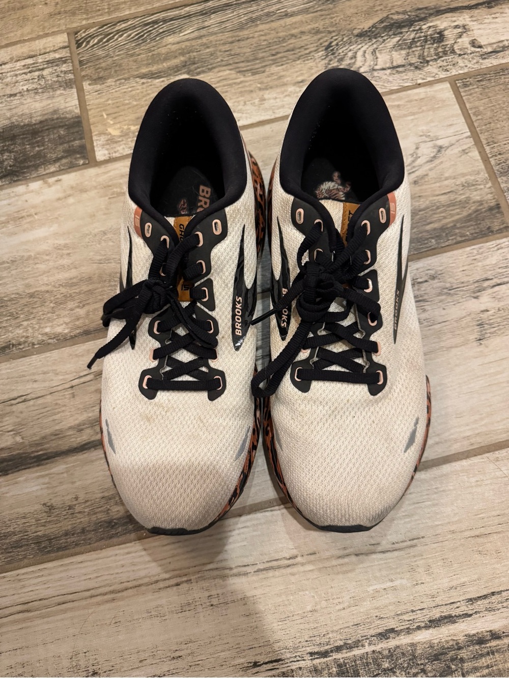 Brooks women’s White and Black Athletic Running Shoes with Orange Accents